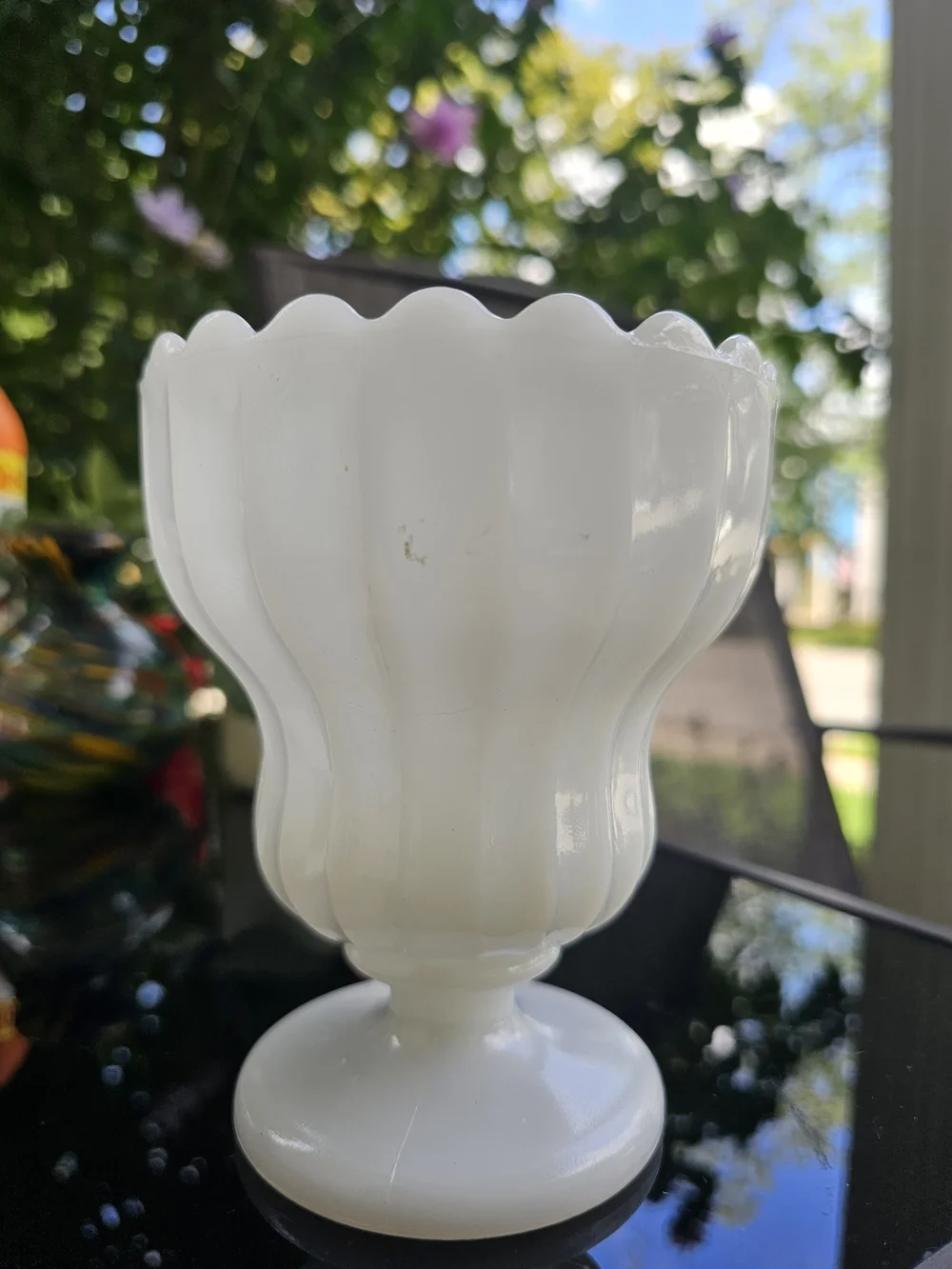 Vintage E.O. Brody white milk glass footed urn planter featuring a fluted body